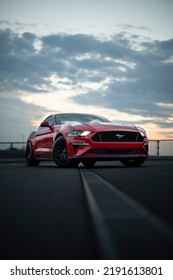 Wroclaw, Poland - August 15, 2022: Ford Mustang GT With Shiny Red Paint Evening Shot