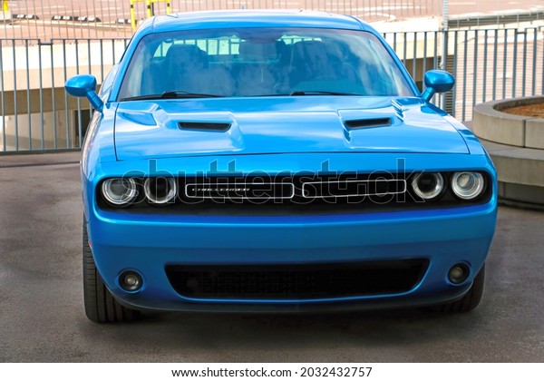 Wroclaw, Poland,\
August 17, 2021: Powerful blue car Dodge Challenger. Muscle car\
manufactured by Dodge, out of\
focus