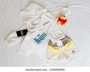 Wroclaw, Poland - August 4, 2022: White Hoodie Embroidered With The Name Bernard And A Picture Of A Bear,  T-shirt With Inscription The Beatles