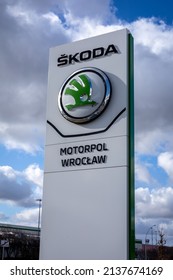 Wroclaw, Poland - February 19, 2022: Closeup Of A Column With An Emblem Of Skoda Auto, Czech  Automobile Manufacturer. No People, Cloudy Sky. 