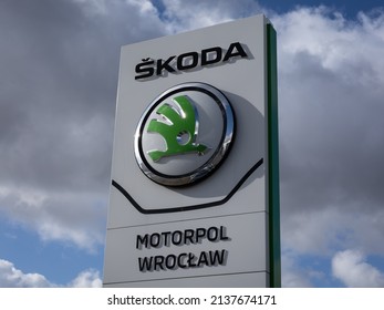 Wroclaw, Poland - February 19, 2022: Closeup Of A Column With An Emblem Of Skoda Auto, Czech  Automobile Manufacturer. No People, Cloudy Sky. 