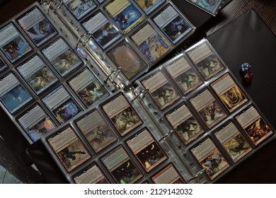 Wroclaw, Poland - February 25 2022: Binders with rare cards for magic the gathering trading card game, top view