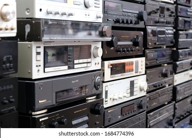 WROCLAW, POLAND - JANUARY, 2020.   Wall of Retro Audio Devices for Sale on a Flea Market. Stereo Amplifiers, Compact Disc Players, Receivers, Video Cassette recorder, Stereo Cassette Deck