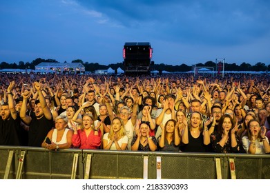 WROCLAW, POLAND - JULY 23, 2022: Concert Tour Meskie Granie 2022 (Men's Playing). Fans In Front Of The Stage.