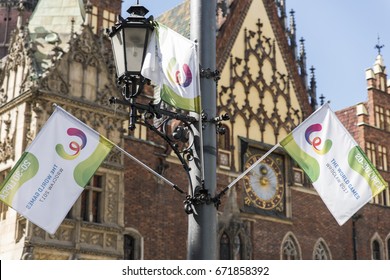 WROCLAW, POLAND - JULY 4th, 2017. The World Games Wroclaw 2017 Flags Waving On The Background Of Wroclaw's City Hall.