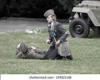 Wroclaw, Poland May 11. Polish Wounded Soldier And Nurse During Historical Reenactment Of WWII, May 11, 2014 Wroclaw, Poland