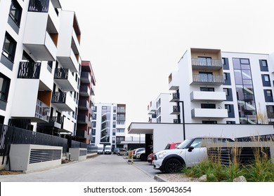 WROCLAW, POLAND - NOVEMBER, 2019.  Street Of Cozy Courtyard Of Modern Residential Buildings District With Parked Cars. No People.