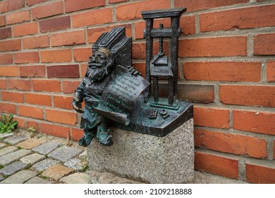 WROCLAW, POLAND - OCTOBER 14, 2021: One Of The Wroclaw Dwarves. Since 2001, To Commemorate The Orange Alternative (Polish Anti-communist Movement), Dwarves Have Been Erected Throughout The City.