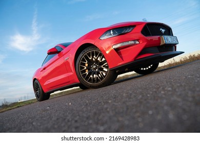 Wroclaw, Poland - October 21, 2019: Dynamic shot of american muscle car Ford Mustang with petrol engine. It's contradiction to modern electric cars