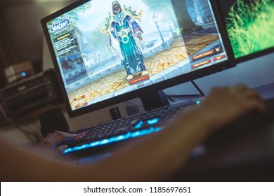WROCLAW, POLAND -  SEPTEMBER 04th, 2018: Woman playing World of Warcraft: Battle of Azeroth game. WoW is a massively multiplayer online role-playing game (MMORPG) released in 2004 by Blizzard.