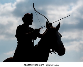 WROCLAW, POLAND - SEPTEMBER 12; 2015: Archer during the Eurasia Cup and the final of Polish Cup Horseback Archery. Competition on the track Hungarian in a Racecourse WTWK Partynice.
