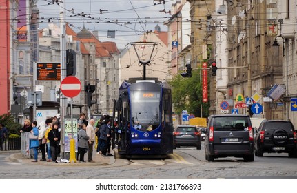 Wroclaw, Poland-7 MAY, 2021: A public transport in Wroclaw, Poland. The tram on the street of Wroclaw. Cityspace with the tram.