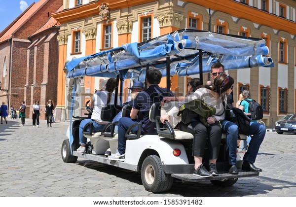 Wroclaw, Republic of\
Poland - May 19, 2019: A car for excursions through ancient Wroclaw\
in the city streets.