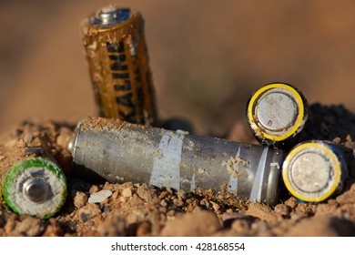 Wrong disposal of batteries. Discarded batteries. Pollution of the environment. Poisoning of nature.