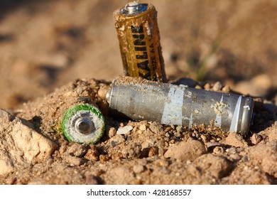Wrong disposal of batteries. Discarded batteries. Pollution of the environment. Poisoning of nature.