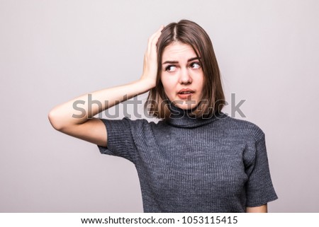 Wrong doing. Closeup portrait upset woman, slapping hand on head having duh moment isolated on gray background.