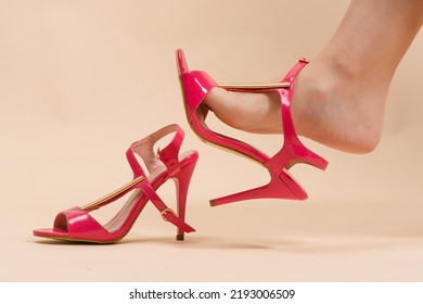 Wrong Size Of Shoes. Woman Is Trying On A New High Heels Shoes In The Footwear Store Close Up.