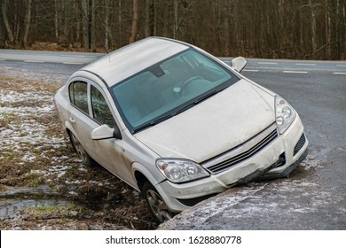 wrong tires and a car in an accident and flying off the road in ice, a broken car as a result of poor adhesion of wheels and asphalt. - Shutterstock ID 1628880778