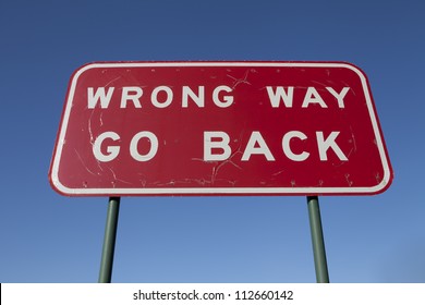 Wrong Way Go Back Road Sign.