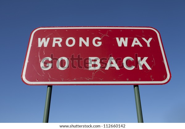 Wrong way go back road\
sign.