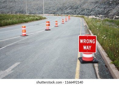 Wrong Way Traffic Sign And Safety Cones.