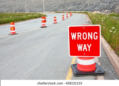 Wrong Way Traffic Sign And Safety Cones.