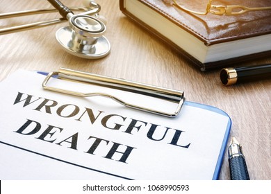 Wrongful death form and stethoscope on a table.