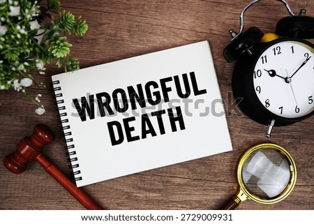 Wrongful Death message written on notepad with alarm clock, wood gavel and magnifying glass flat lay on wooden background
