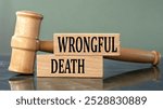 WRONGFUL DEATH - words on wooden blocks with a judge