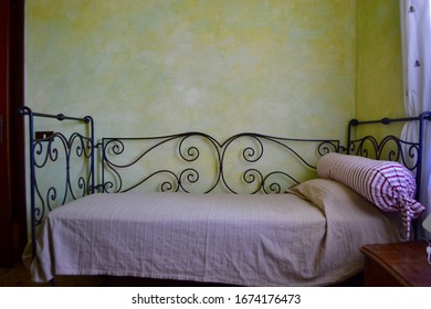 Wrought Iron Bed With Purple Sheets