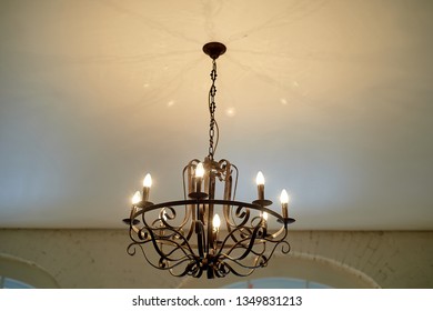 Wrought Iron Chandelier On The Ceiling.Loft Style