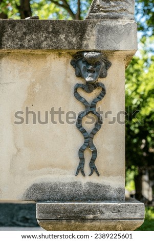 Wrought iron decoration on Molière's grave at Père Lachaise cemetery in Paris, France. 