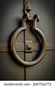 Wrought Iron Door Handle On A Metal Gate In The Shape Of A Circle