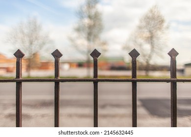 Wrought iron gate detail spikes selective focus shot