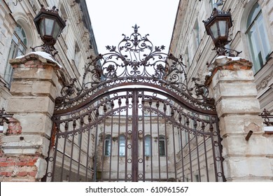 The Wrought Iron Gates On Crumbling Building