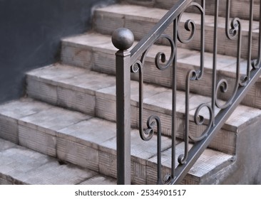 Wrought iron railing near stairs on tile porch of private home.  - Powered by Shutterstock