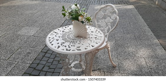 Wrought Iron Table And Chair In The Garden