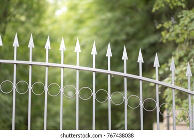 Wrought iron tracery fence fragment.