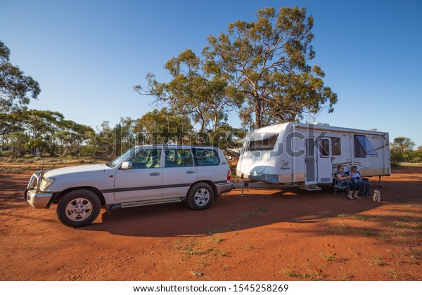 WUBIN, AUSTRALIA -\
SEP 17 2019:  Retired couples each year travel northwards in 4WD\'s\
and caravans in the spring and free camp in the bush to view the\
annual wildflowers.