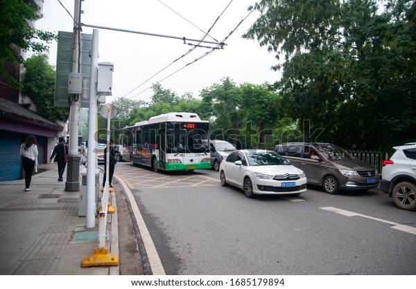 Wuhan, China - April 22, 2019:  Busy road in\
Wuhan city town during\
daytime.