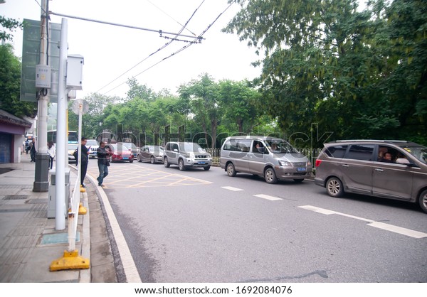 Wuhan, China - April 22, 2019:  Busy road in\
Wuhan city town during\
daytime.