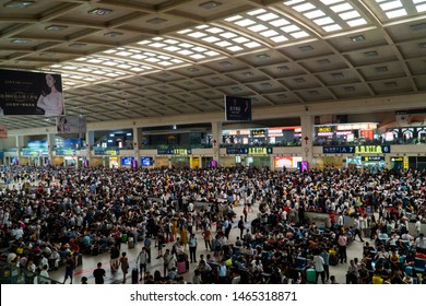 Wuhan, China - July 05 2019: Crowded Railway Station In China. Huge Crowd Waiting At Railway Station. People With Baggage Waiting For The Train In China.