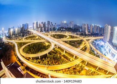 Wuhan, China - May 10, 2019: a busy traffic flow on the ma ying road overpass viaduct, next to rows of high-rise commercial buildings and residences. China has more than 200 million cars.