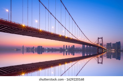 Wuhan parrot shoal yangtze river bridge in nightfall, hubei, China, suspension bridge. - Powered by Shutterstock