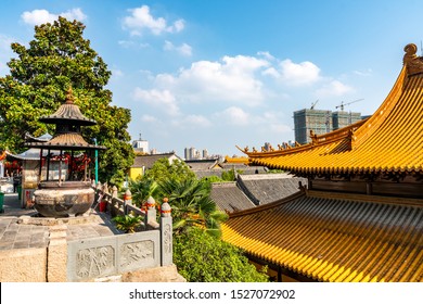 Wuhu Anhui Guangji Buddhist Monastery Temple With Candle Joss And Hall Of Four Heavenly Kings Roof View On A Sunny Blue Sky Day