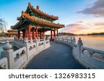 Wulong Pavilion in Beihai Park under the setting sun