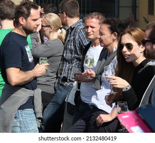 Wurzburg, Germany - May 4, 2014: People Walk And Drink Wine On The Old Main Bridge In Wurzburg, Germany On May 4, 2014