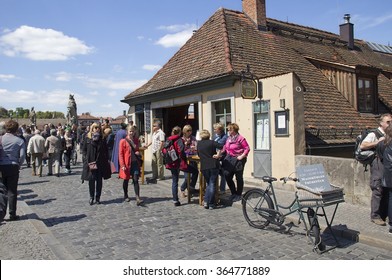 Wurzburg, Germany - May 4, 2014: People Drink Wine At The Cafe In The Old Custom House On The Old Main Bridge In Wurzburg, Germany On May 4, 2014