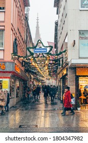 Wurzburg/Germany-3/1/19: Schustergasse, On A Snowy Winter Day, In The Centre Of Wurzburg, Brightly Decorated For Christmas