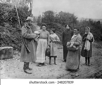 WW1 German Soldier Inspects Documents Of Women In Occupied France. 1915-16.